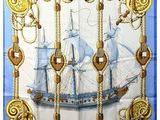 blue and white square scarf with a ship on it