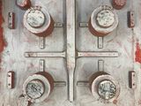 a close up of a fire hydrant on the side of a building