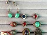 a close up of a bunch of jewelry on a table