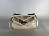 a white purse with a chevron design on the front