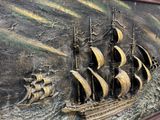 a picture of a ship that is on the wall