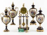 a lot of vases that are sitting on a table