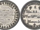 a close up of a silver coin with a white background