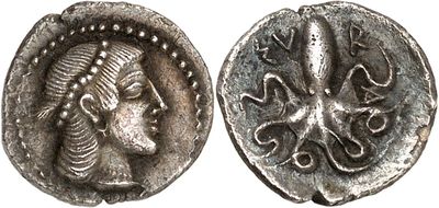a silver coin with a woman ' s face on it