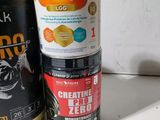 a can of nuttamgen and a can of creatine next to each other