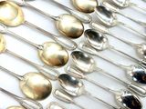 a lot of spoons that are sitting on a table