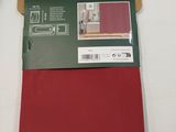 the packaging of a red sheet is on a white surface