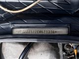 a close up of a motorcycle with a number plate on it