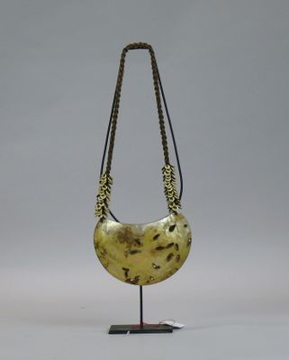 necklace made from a piece of wood with a chain around it