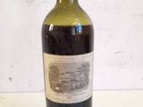 a bottle of wine that is sitting on a table