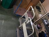 a green trash can and a blue trash can in a room
