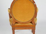 an image of a wooden chair with a yellow upholstered seat