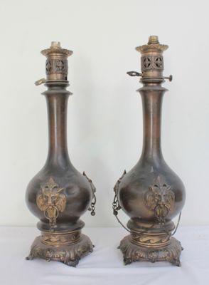 two vases that are sitting on a table