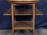 an old wooden table with a tray on top of it