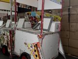 a food cart that is sitting in a warehouse