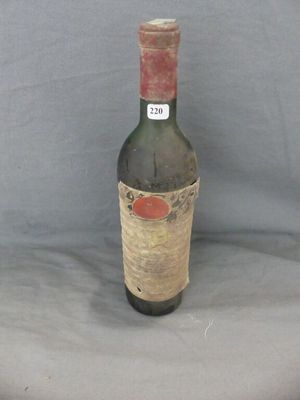 a bottle of wine that is sitting on a table