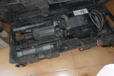 a black case with tools inside of it on a tiled floor