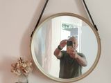 a man taking a picture of himself in a mirror