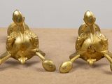 pair of antique brass figurines of a duck and a duckling