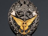 a close up of a badge on a black surface