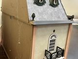 a doll house that is sitting on top of a table