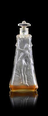 an etched glass decanter with a woman and a bird on it
