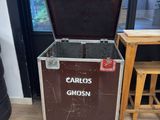 a trunk that is sitting on the floor in front of a table