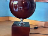 a lamp that is on top of a wooden table