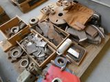 a pile of assorted metal items on a pallet