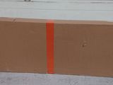 a cardboard box that is sitting on the ground