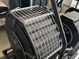 a metal cage on top of a machine in a room