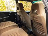 the interior of a car with two seats and a steering wheel