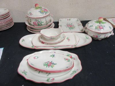 a black table with a bunch of plates and bowls on it