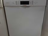 a white dishwasher and a white dishwasher in a kitchen