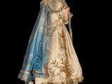 statue of a woman dressed in a blue and gold dress