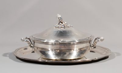 a silver plate with a silver lid on it
