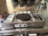 an image of a stove top with a pan on it