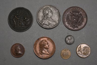 a lot of coins that are sitting on a table