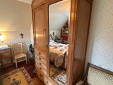 an image of a bedroom with a bed and a mirror