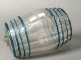 a glass jar with a blue stripe around it