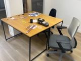 a desk with a chair and a computer on it