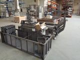 a large warehouse with a lot of metal items on the floor