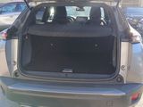the back of a car with its trunk open in a parking lot