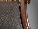 a brown chair with a black and white pattern on it