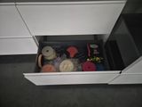 a drawer that has a bunch of items inside of it