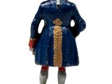 figurine of a man in a blue coat and hat
