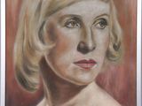 tableau représentant une femme aux cheveux blonds et aux yeux verts, dans un cadre argenté