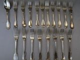 an assortment of silverware including forks, spoons and spoons