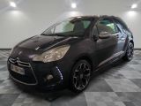 the black citrole is parked in the garage on a checkered floor