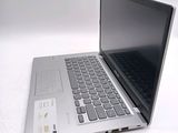 a laptop computer sitting on top of a white table